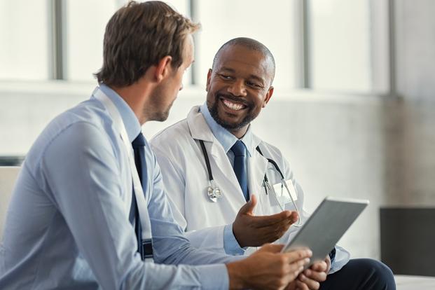 A board-certified provider consulting with a patient during a telehealth visit